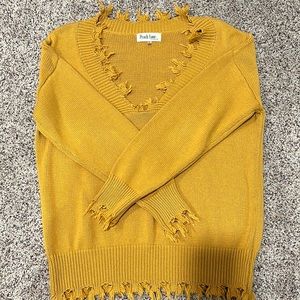 Slightly oversized distressed sweater